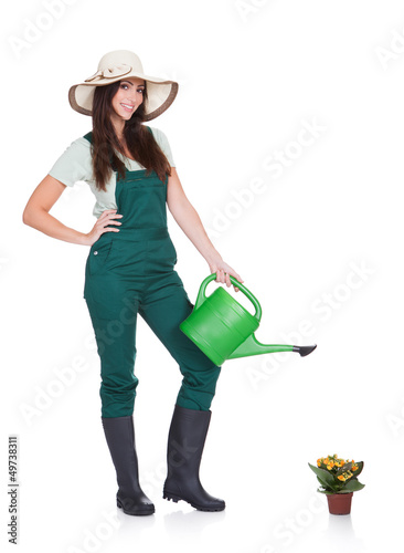 Photo: Beautiful Happy Woman Holding Watering Can Beautiful Happy Woman Holding Watering Can
