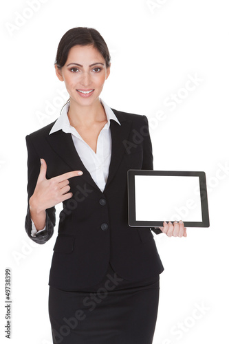 Photo: Smiling Businesswoman Holding Digital Tablet Smiling Businesswoman Holding Digital Tablet