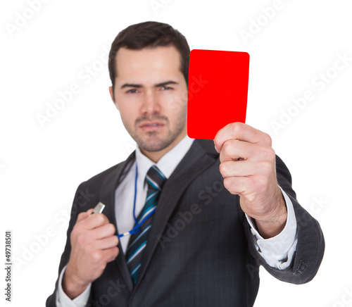 Photo: Businessman showing red card Businessman showing red card