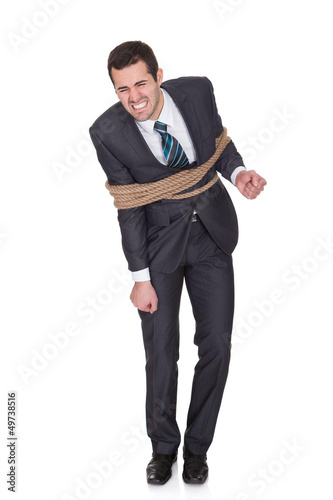 Photo: Businessman tied up in rope Businessman tied up in rope