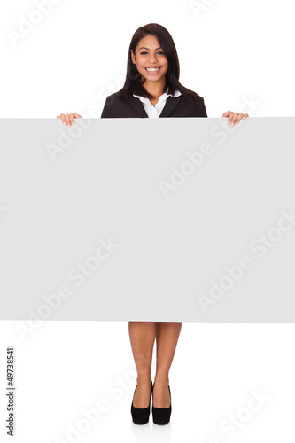 Photo: Happy Businesswoman Holding Placard Happy Businesswoman Holding Placard