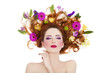 Beautiful redhead girl with flowers isolated.
