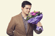 man with flowers in hand