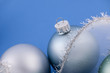 Christmas baubles on blue