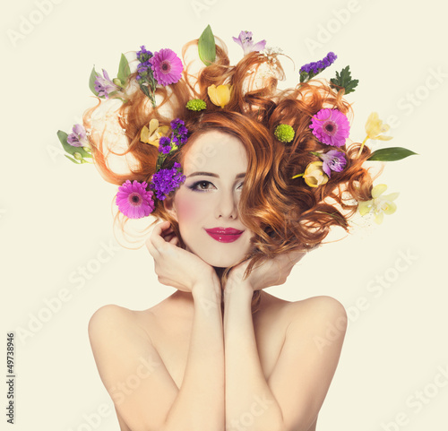  Beautiful redhead girl with flowers isolated.
