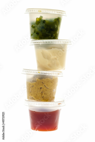 Photo: Stack of condiment containers Stack of condiment containers