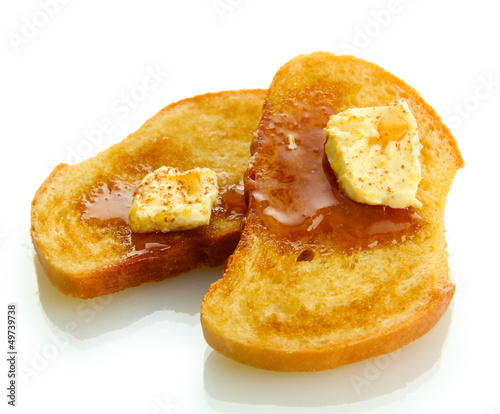Photo: White bread toast with honey on plate, isolated on white White bread toast with honey on plate, isolated on white