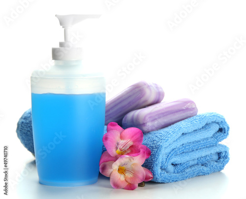 Photo: Bottle, soap and towel, isolated on white Bottle, soap and towel, isolated on white