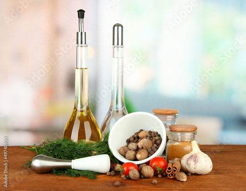 Photo: Composition of mortar, bottles with olive oil and vinegar, and Composition of mortar, bottles with olive oil and vinegar, and