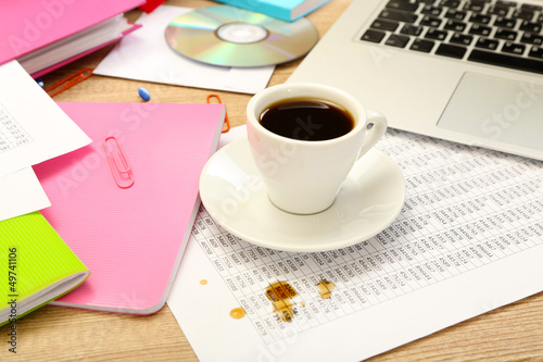 Photo: Cup of coffee on office desktop close-up Cup of coffee on office desktop close-up