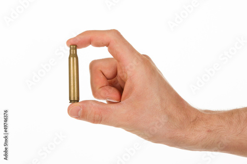 Photo: Hand holding an empty cartridge Hand holding an empty cartridge