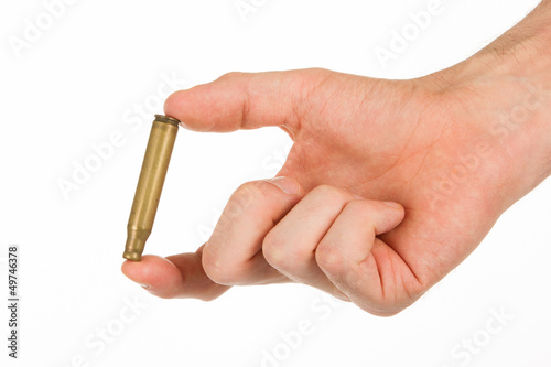 Photo: Hand holding an empty cartridge Hand holding an empty cartridge