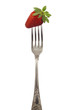 Strawberry on silver fork isolated
