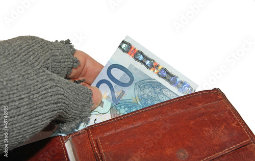 Photo: hand of the poor man who steals euro money from wallet hand of the poor man who steals euro money from wallet