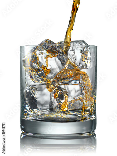 Photo: Pouring Scotch Whisky in Glass with perfect ice Pouring Scotch Whisky in Glass with perfect ice