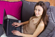 teenage girl using laptop