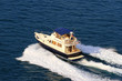 Yacht with splash and wake