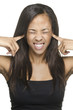 Woman with fingers in ear too  much noise