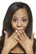 Woman with hands on mouth hiding expression