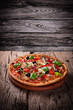 Delicious italian pizza served on wooden table