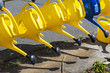 watering cans hanging for use at the cemetery