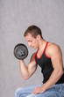 Photo: Man Working Out With A Dumbbell On White Man Working Out With A Dumbbell On White