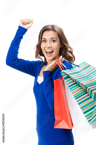 Photo: Young happy woman with shopping bags, isolated Young happy woman with shopping bags, isolated