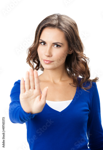 Photo: Serious woman with stop gesture, isolated Serious woman with stop gesture, isolated
