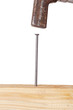 Hammer and nail with wooden board