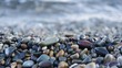 Close up of very calm sea surf splashing on a pebble beach
