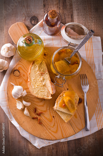 Photo: Sliced bread with peppers under oil. Sliced bread with peppers under oil.