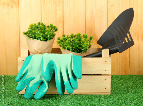 Photo: Garden tools on grass in yard Garden tools on grass in yard