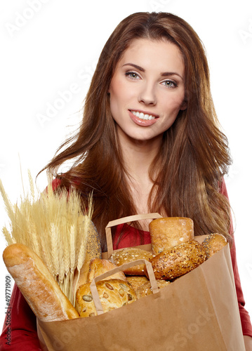 Photo: Smiling woman holding a grocery bag Smiling woman holding a grocery bag