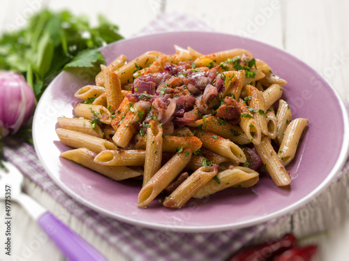 Photo: pasta with onions parsley and hot chili pepper, selective focus pasta with onions parsley and hot chili pepper, selective focus