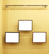 Three frames with isolated canvas on the exhibition ledge