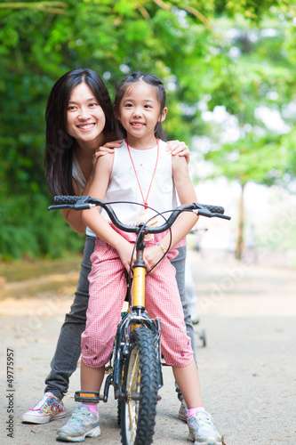 Photo: Asian family riding bike Asian family riding bike