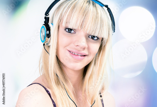 Photo: Girl listening to music with headphone Girl listening to music with headphone