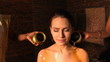 Woman having Ayurvedic spa treatment.