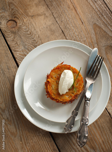 Photo: Potato pancake with sour cream Potato pancake with sour cream