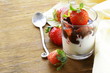 dairy dessert with chocolate sauce and strawberries