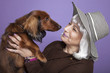 Middle-aged woman holding a dog