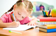 little girl is writing
