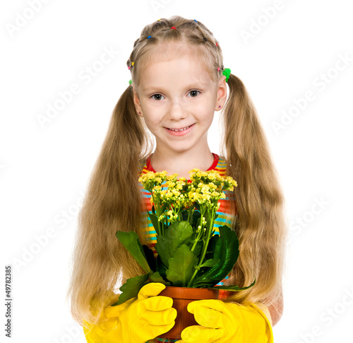 Photo: little girl holding a plant little girl holding a plant