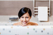 Beautiful girl relaxes in bath, hygiene concept