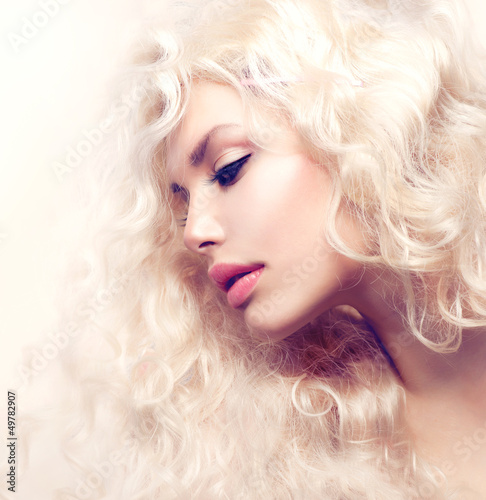 Photo: Curly Hair. Fashion Girl With Healthy Long Wavy Hair Curly Hair. Fashion Girl With Healthy Long Wavy Hair
