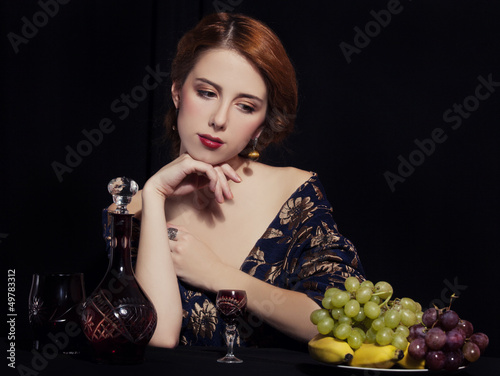 Photo: Portrait of beautiful rich women with grapes. Portrait of beautiful rich women with grapes.