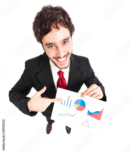 Photo: Smiling young businessman showing a business plan Smiling young businessman showing a business plan