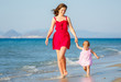 Mother and daughter on the beach