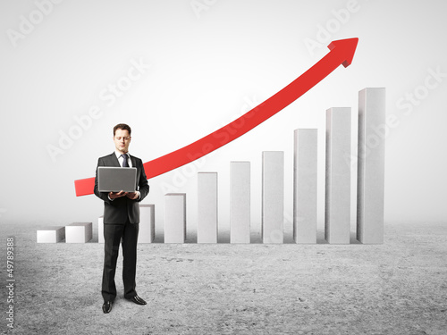 Photo: man and chart profits man and chart profits