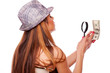 Woman with magnifier glass and money